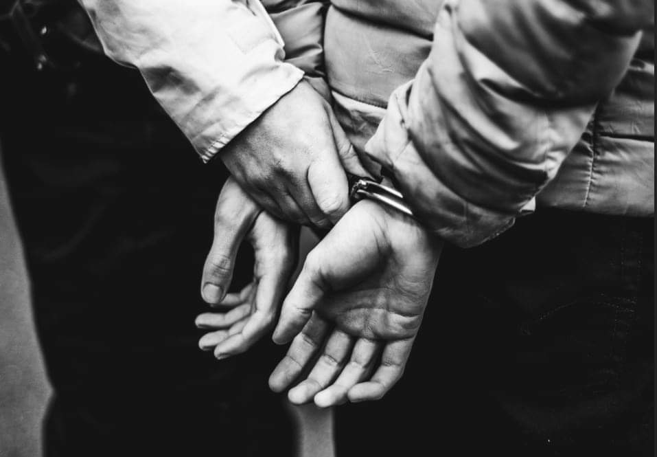 Hands in cuffs