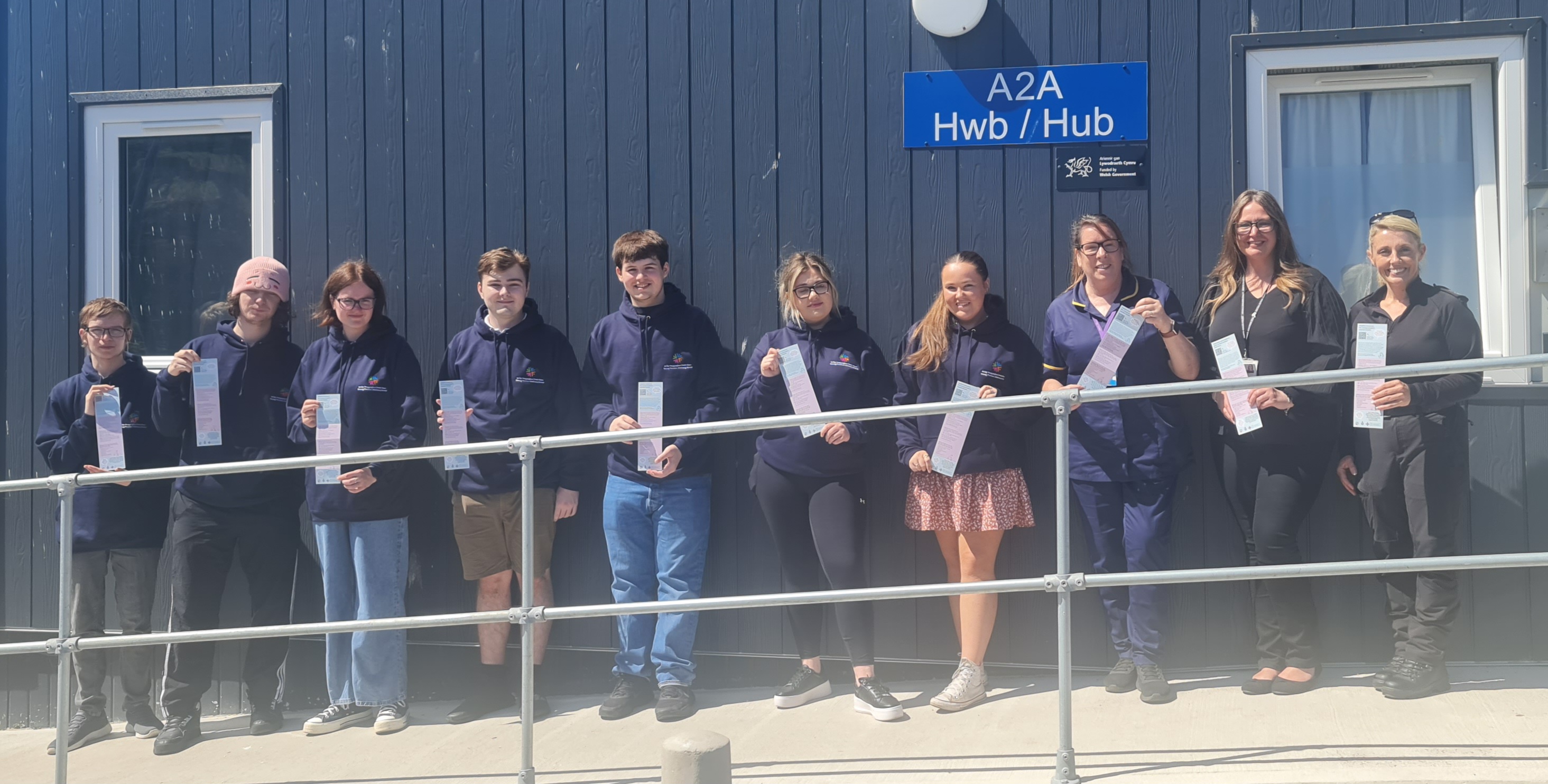 North Wales Young Ambassadors, NWP officers and CAMHS staff hold up the new Z-Card in support of mental health and wellbeing for young people.