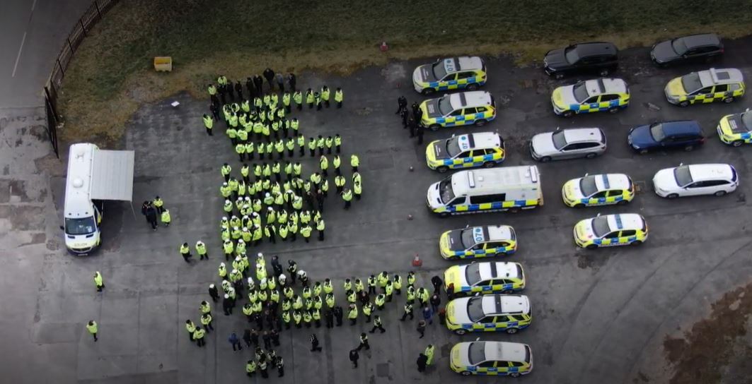 aerial view of officer briefing