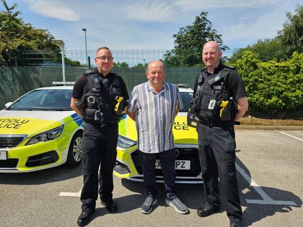 .Neville Owen with PC Duncan Logan and PC Huw Capper