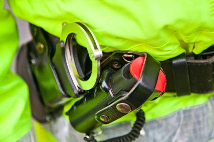 Photo of police handcuffs and captor spray
